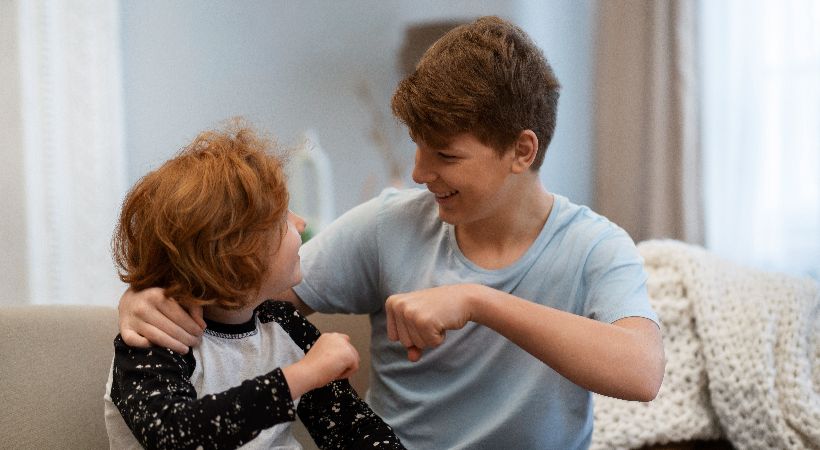 Two children supporting each other 