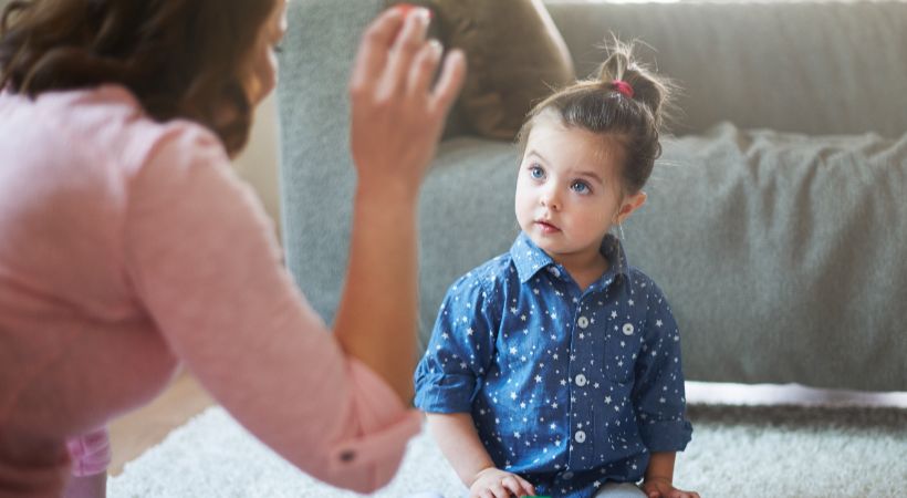 Someone helping a child work through their emotions