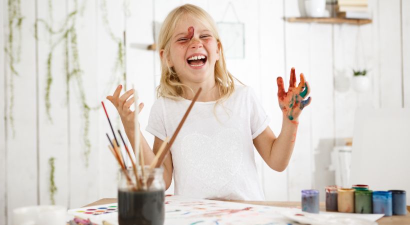 A child expressing their emotions through creative therapies.